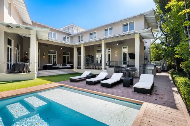 a view of a patio with swimming pool table and chairs