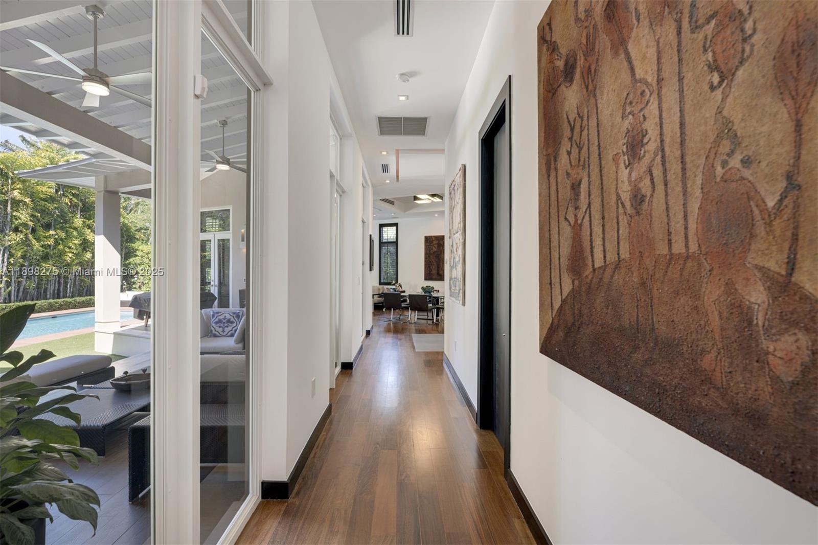 765 Allendale Road Key Biscayne, FL 33149 - Photo 3 of 29 a view of a hallway with wooden floor and staircase