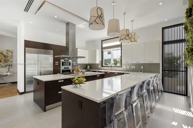 a kitchen with a stove a refrigerator and a sink