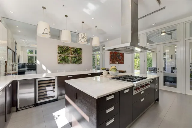 a kitchen with stainless steel appliances granite countertop a stove and a sink