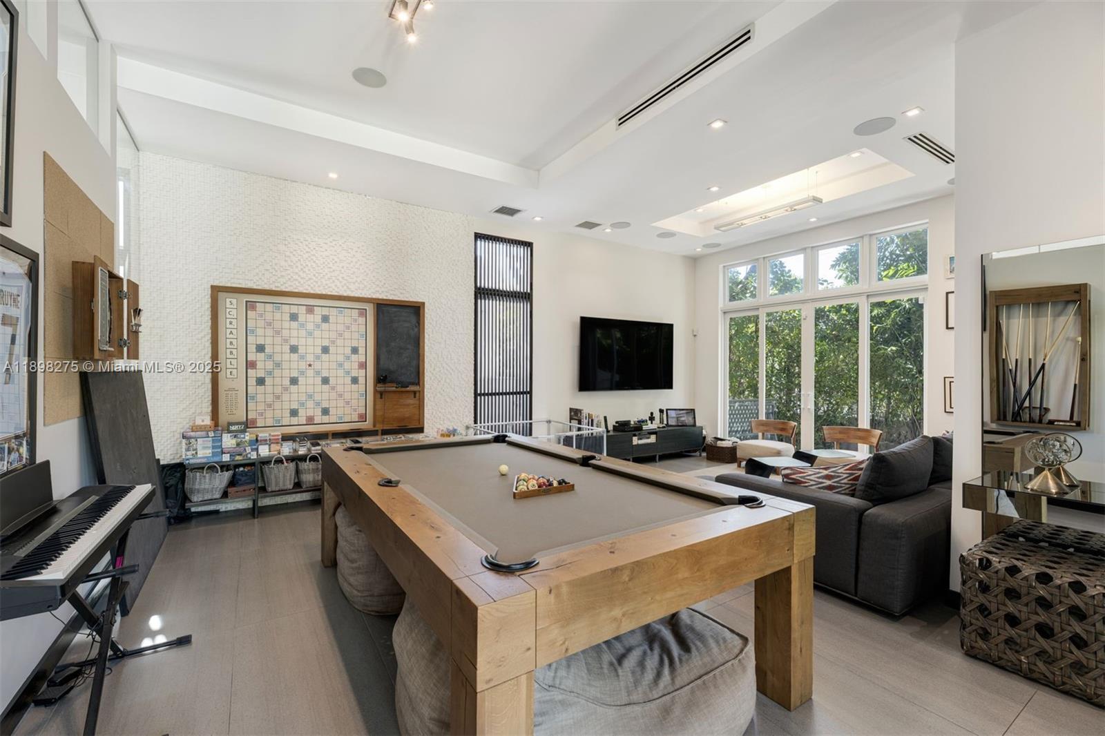 765 Allendale Road Key Biscayne, FL 33149 - Photo 6 of 29 a view of a livingroom with furniture and a flat screen tv
