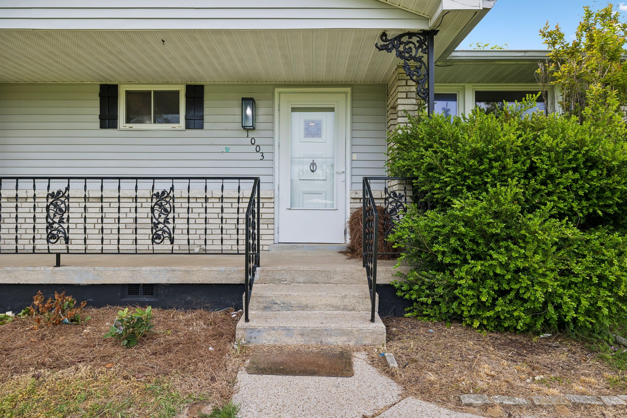 1003 Twin Creek Road Charlotte, TN 37036 - Photo 2 of 37 a front view of a house with a garden