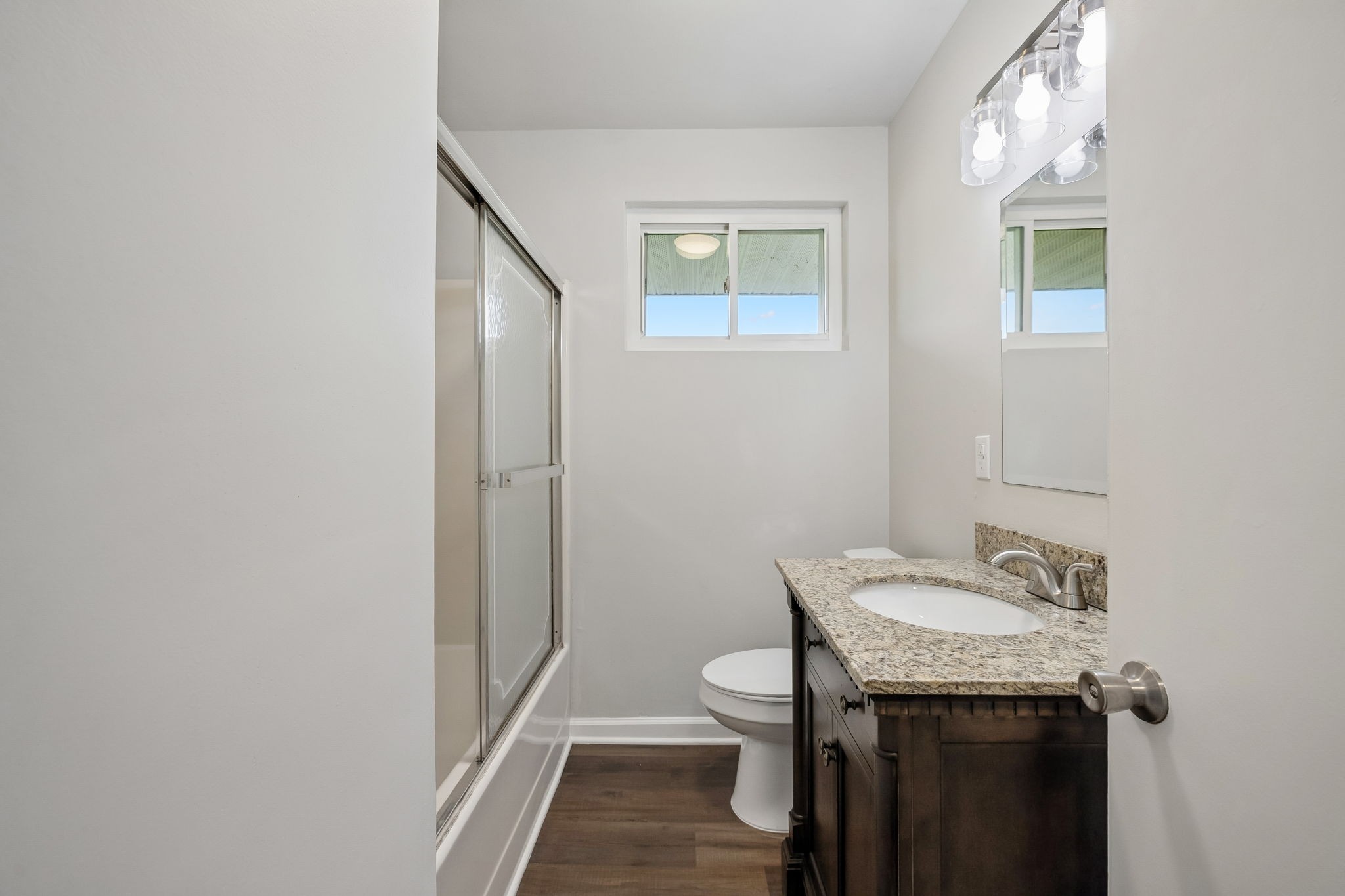 1003 Twin Creek Road Charlotte, TN 37036 - Photo 25 of 37 a bathroom with a sink a toilet and vanity