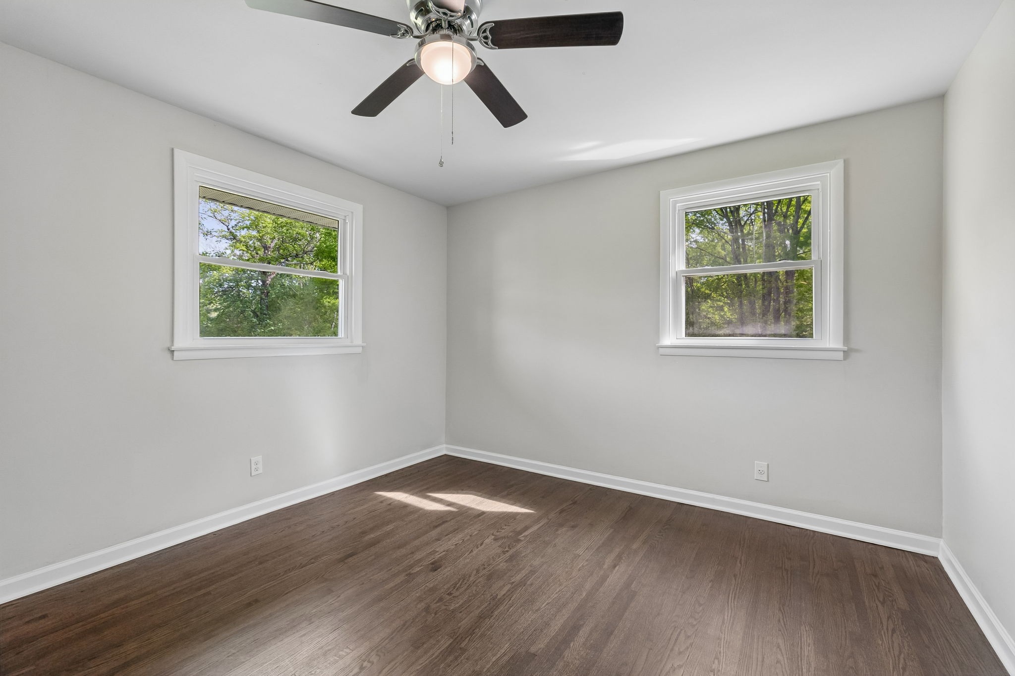 1003 Twin Creek Road Charlotte, TN 37036 - Photo 28 of 37 a view of an empty room with wooden floor and a window