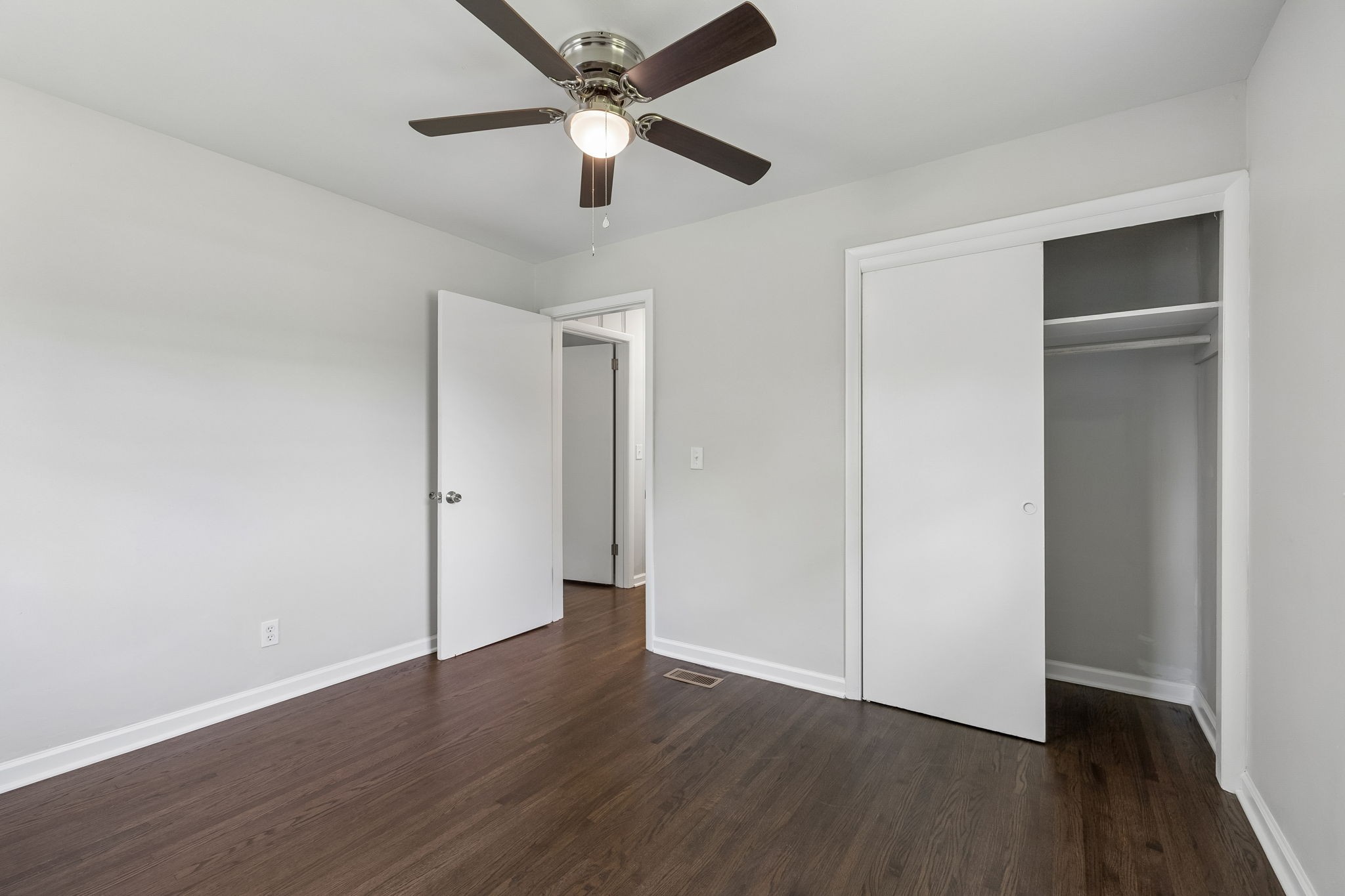 1003 Twin Creek Road Charlotte, TN 37036 - Photo 29 of 37 an empty room with wooden floor and ceiling fan