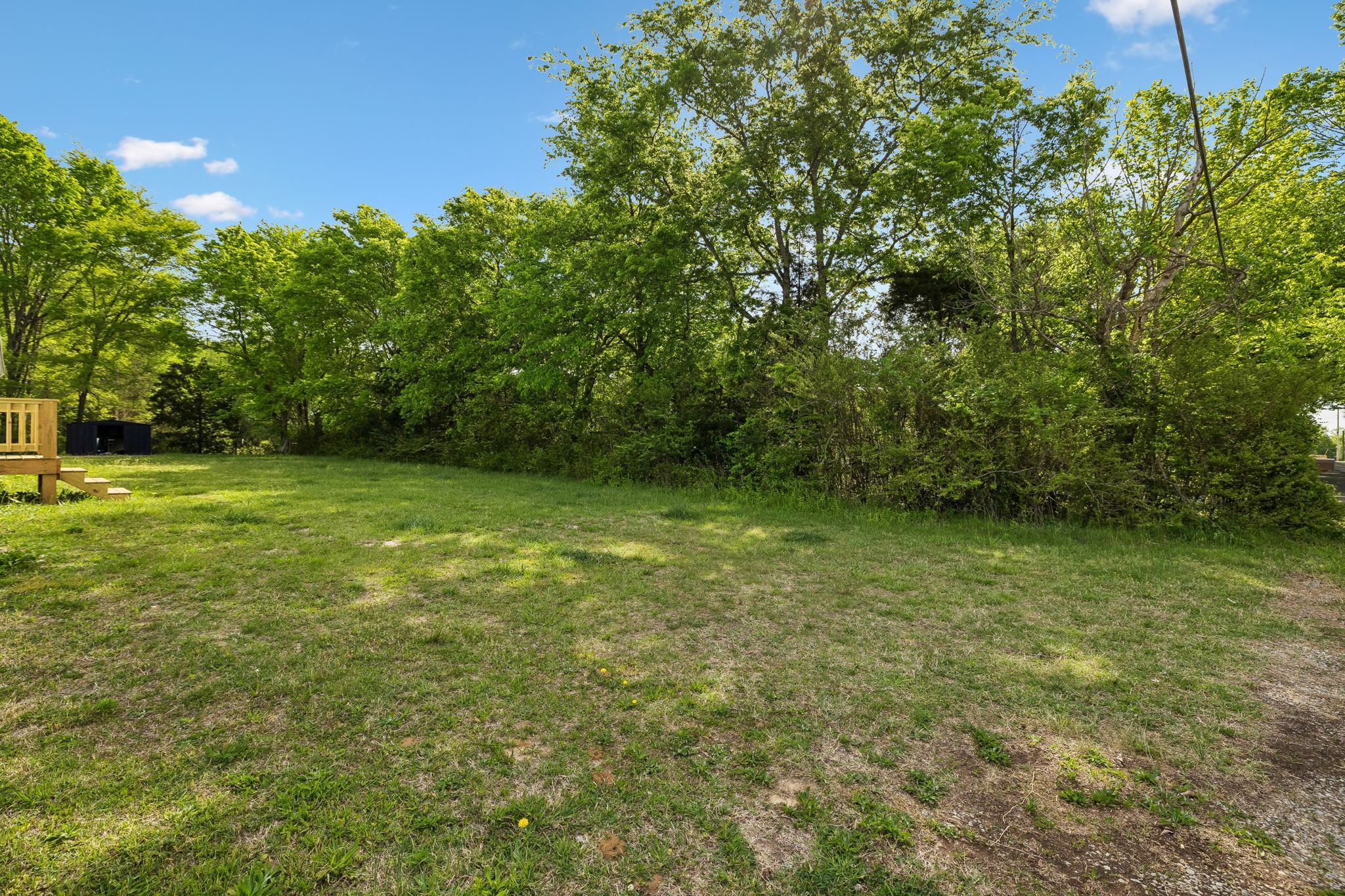 1003 Twin Creek Road Charlotte, TN 37036 - Photo 32 of 37 a view of a field with a trees in the background