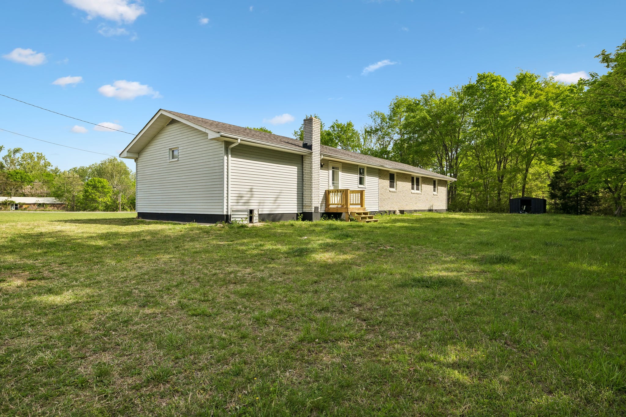 1003 Twin Creek Road Charlotte, TN 37036 - Photo 33 of 37 a big house with a big yard and large trees