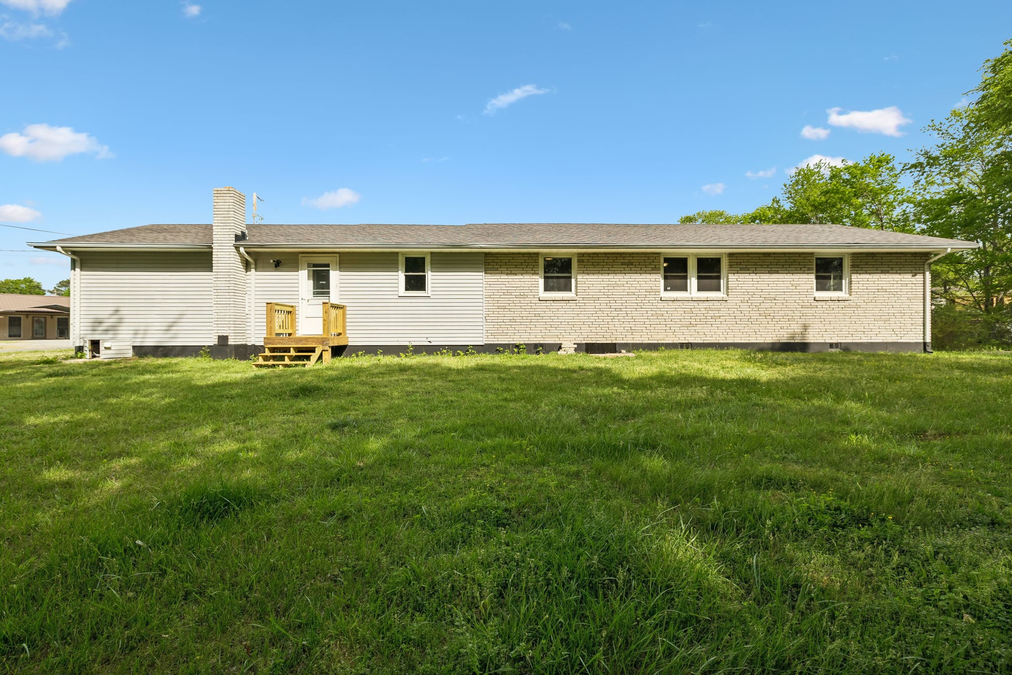 1003 Twin Creek Road Charlotte, TN 37036 - Photo 34 of 37 a front view of house with yard and trees in the background