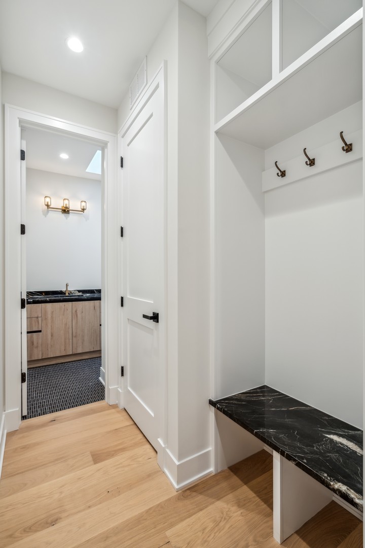 232 South Green Street, Unit 4S Chicago, IL 60607 - Photo 14 of 42 a view of kitchen and empty room with wooden floor