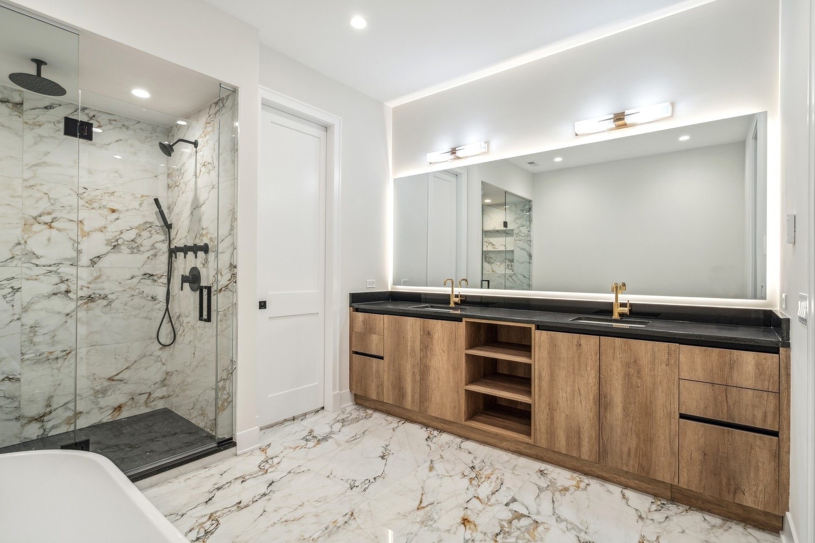 232 South Green Street, Unit 4S Chicago, IL 60607 - Photo 20 of 42 a bathroom with a double vanity sink a toilet a mirror and shower