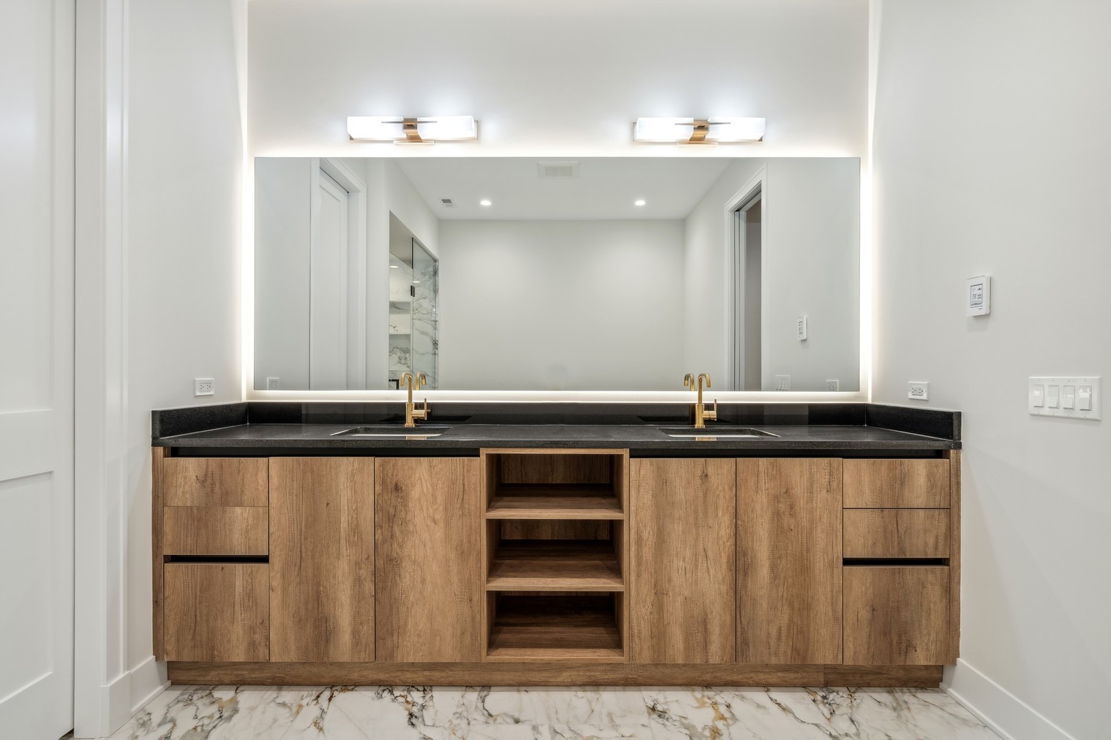 232 South Green Street, Unit 4S Chicago, IL 60607 - Photo 21 of 42 a bathroom with a sink and a mirror