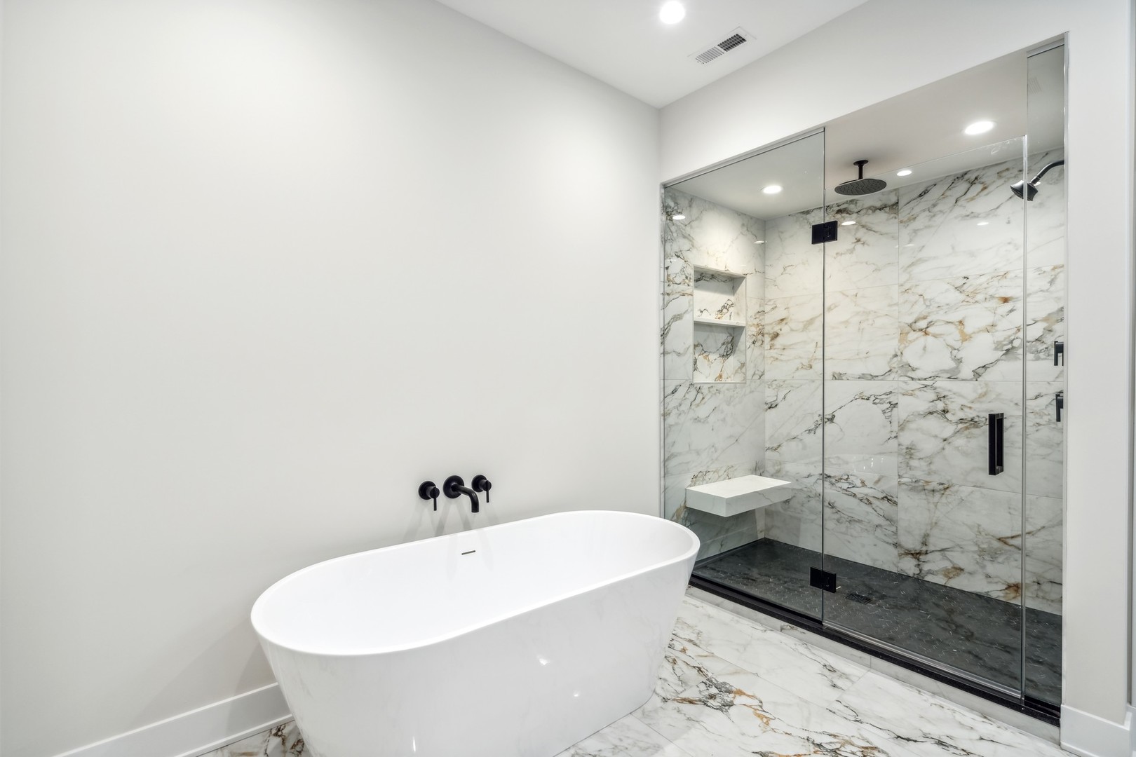 232 South Green Street, Unit 4S Chicago, IL 60607 - Photo 22 of 42 a bathroom with a bathtub and shower