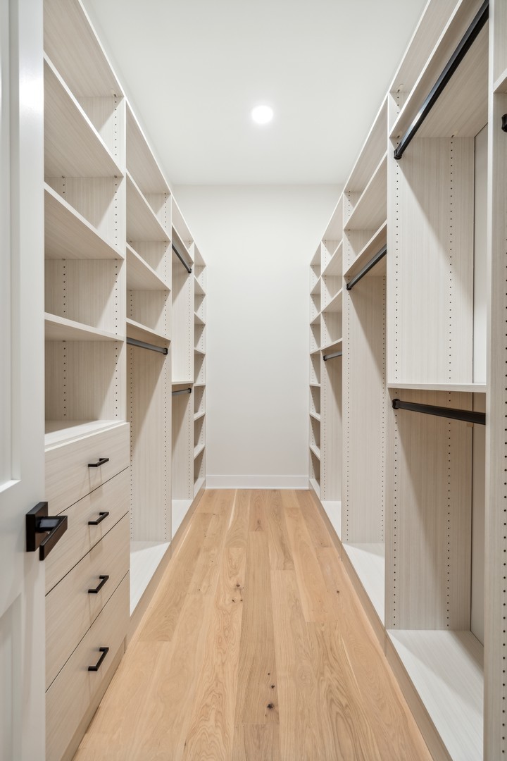 232 South Green Street, Unit 4S Chicago, IL 60607 - Photo 23 of 42 a view of walk in closet with empty racks