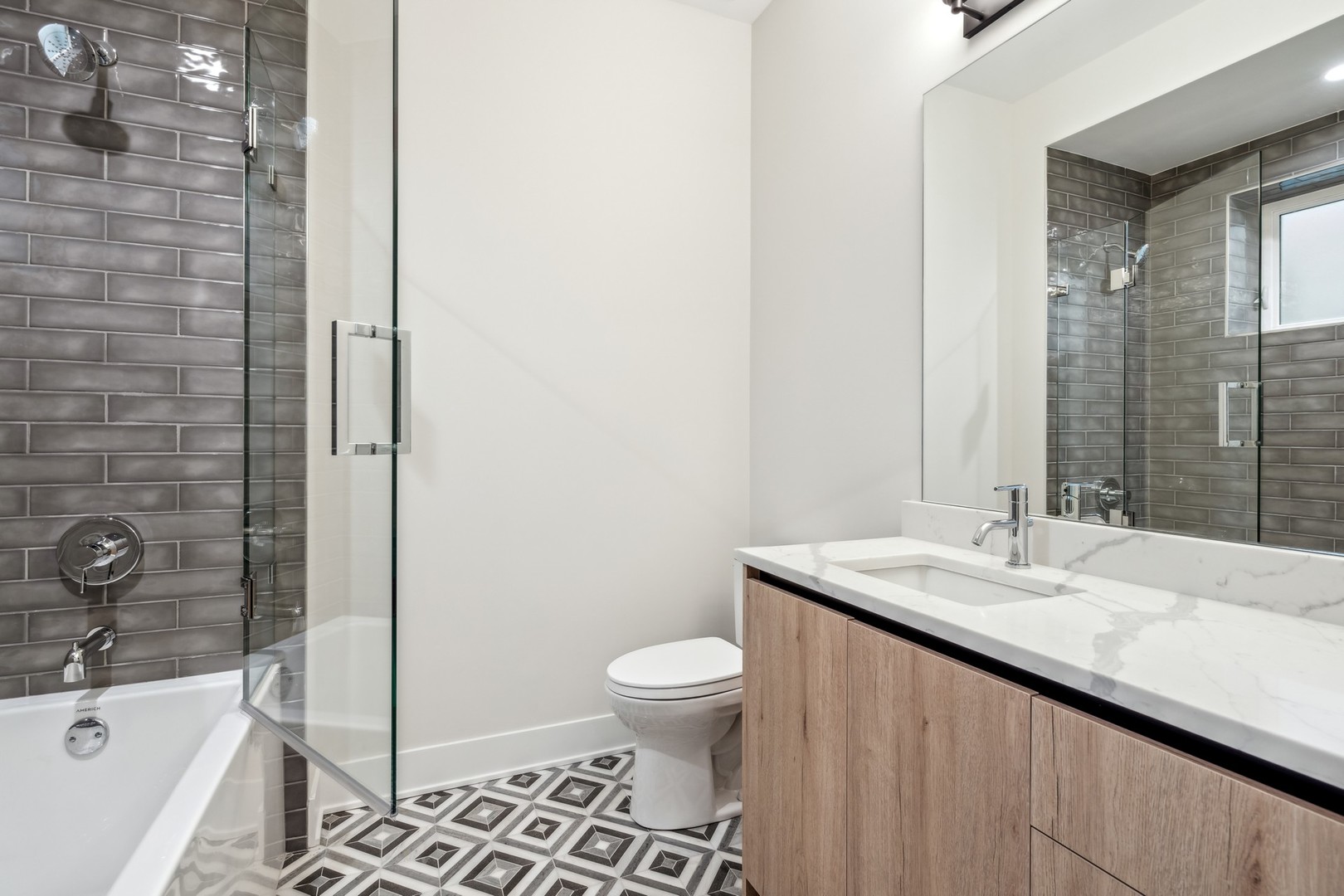 232 South Green Street, Unit 4S Chicago, IL 60607 - Photo 29 of 42 a bathroom with a sink a toilet and shower