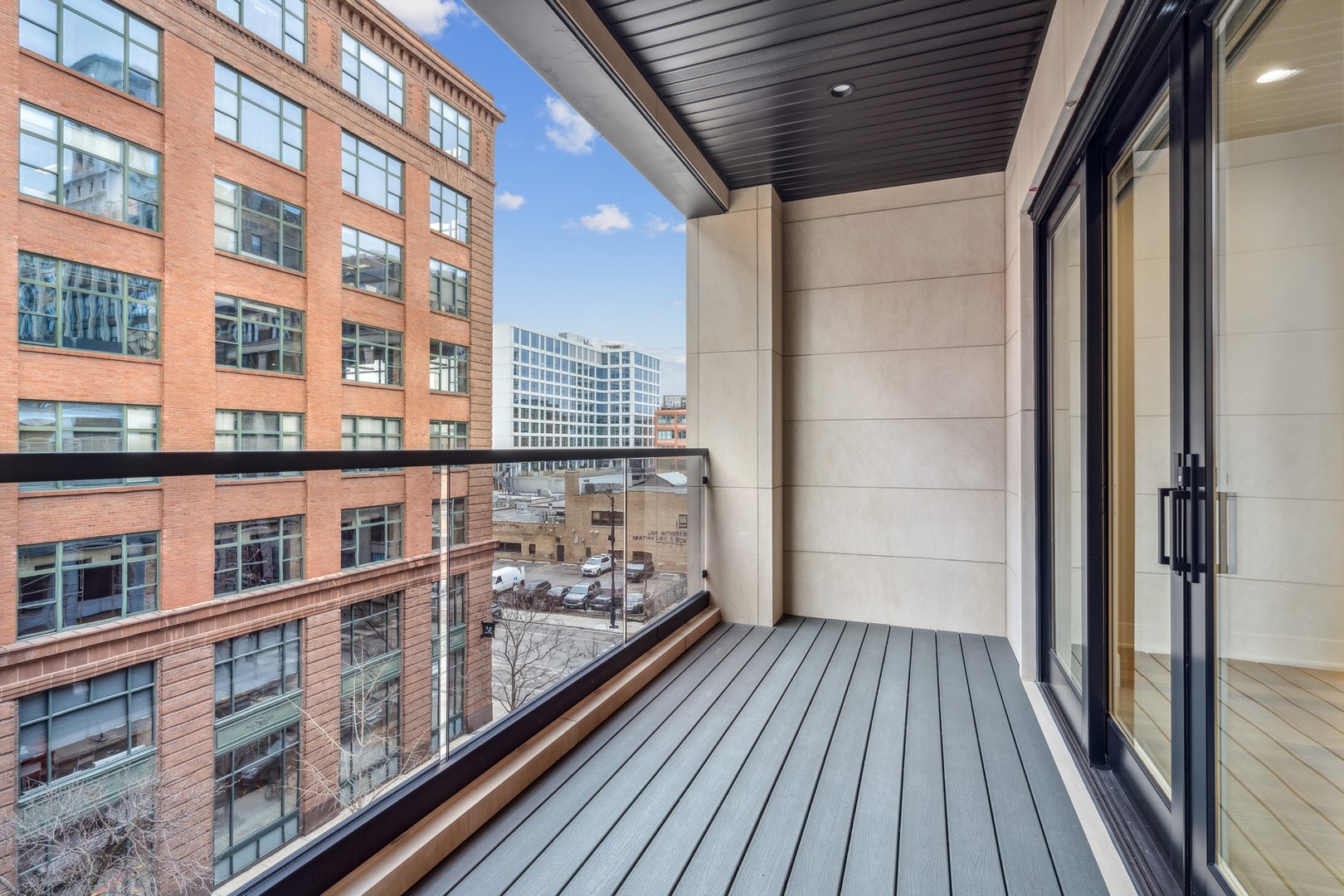 232 South Green Street, Unit 4S Chicago, IL 60607 - Photo 39 of 42 a view of a balcony with wooden floor