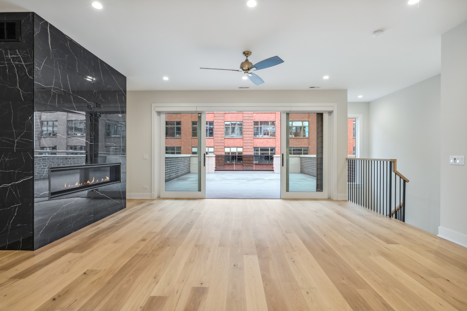 232 South Green Street, Unit 4S Chicago, IL 60607 - Photo 9 of 42 a big room with wooden floor and windows