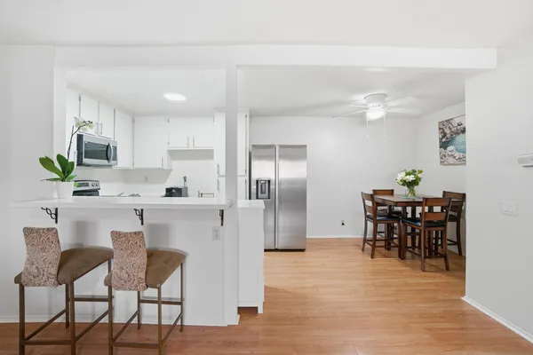a kitchen with a sink and a stove top oven