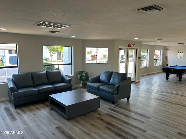 a living room with furniture and a table