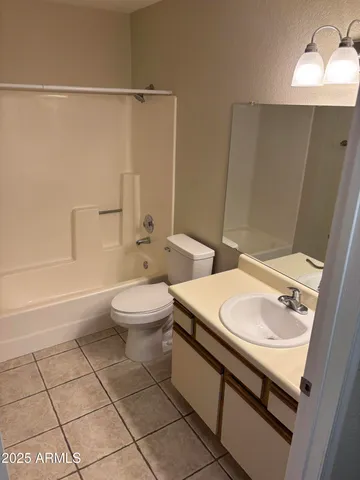 a view of a livingroom with an empty space and a window