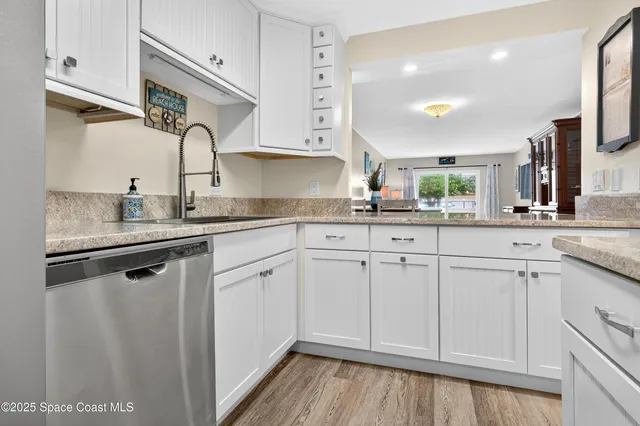 a view of kitchen with kitchen island dining table and chairs