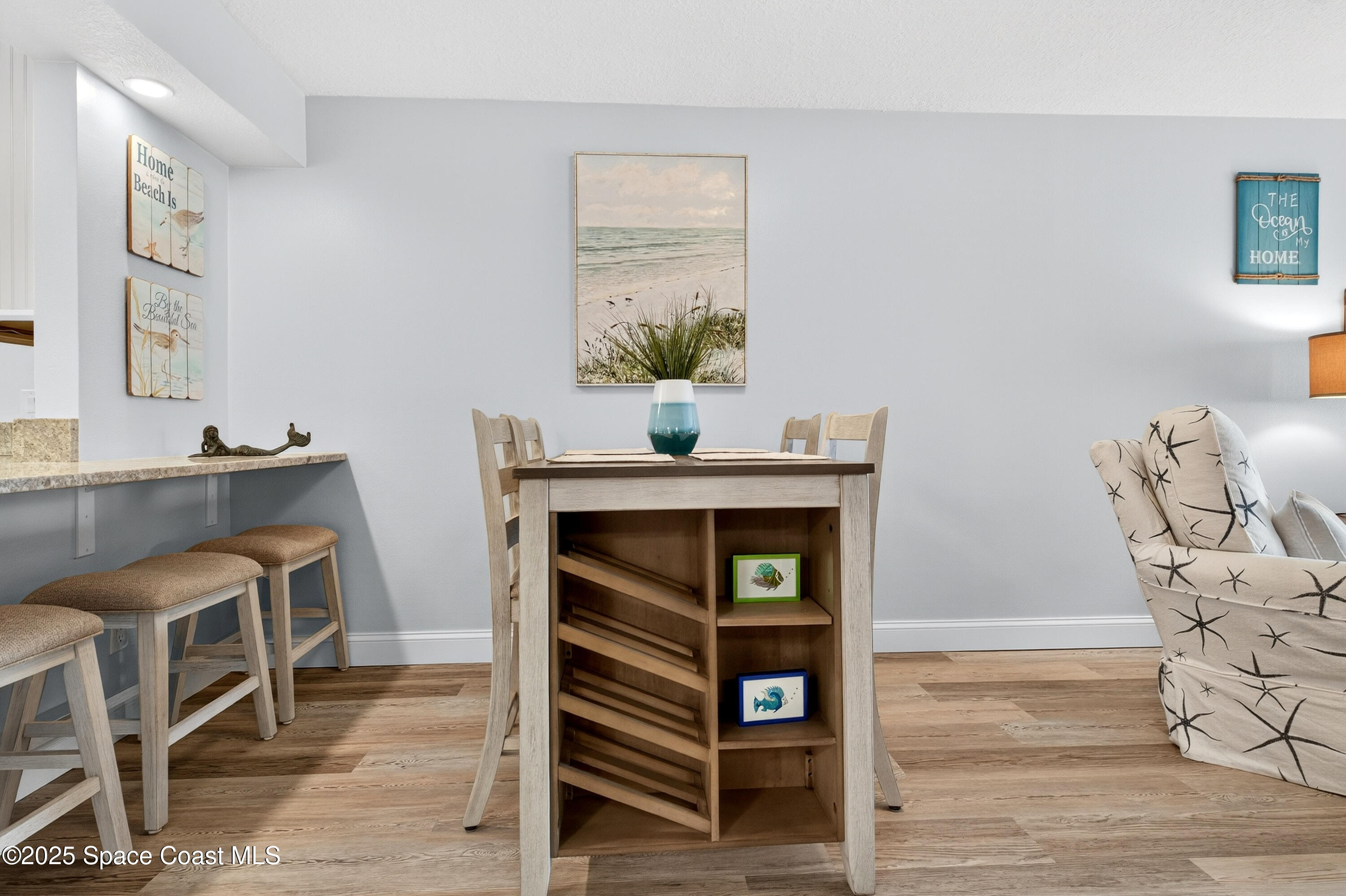 383 North Atlantic Avenue, Unit 105 Cocoa Beach, FL 32931 - Photo 22 of 67 a view of a livingroom with furniture and staircase