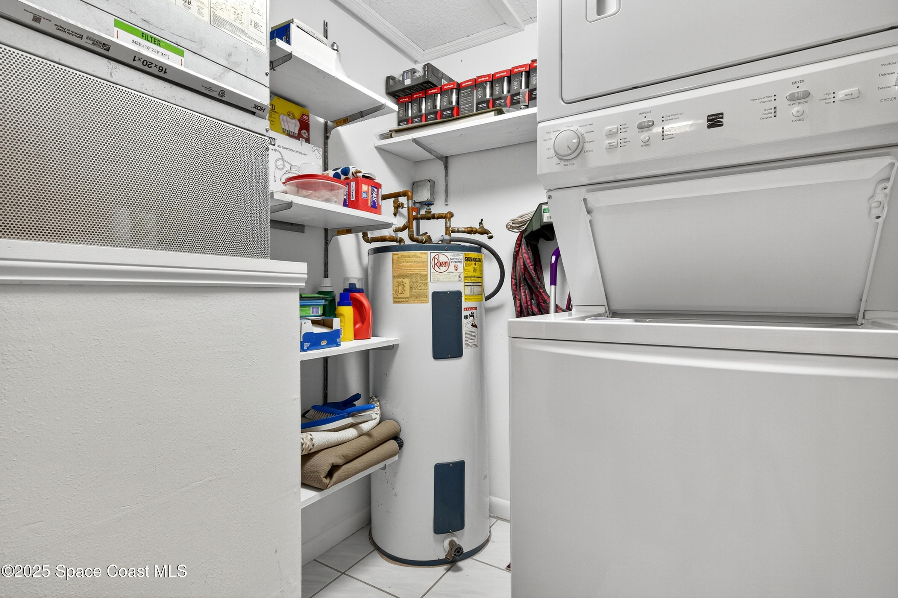383 North Atlantic Avenue, Unit 105 Cocoa Beach, FL 32931 - Photo 24 of 67 a utility room with dryer and washer