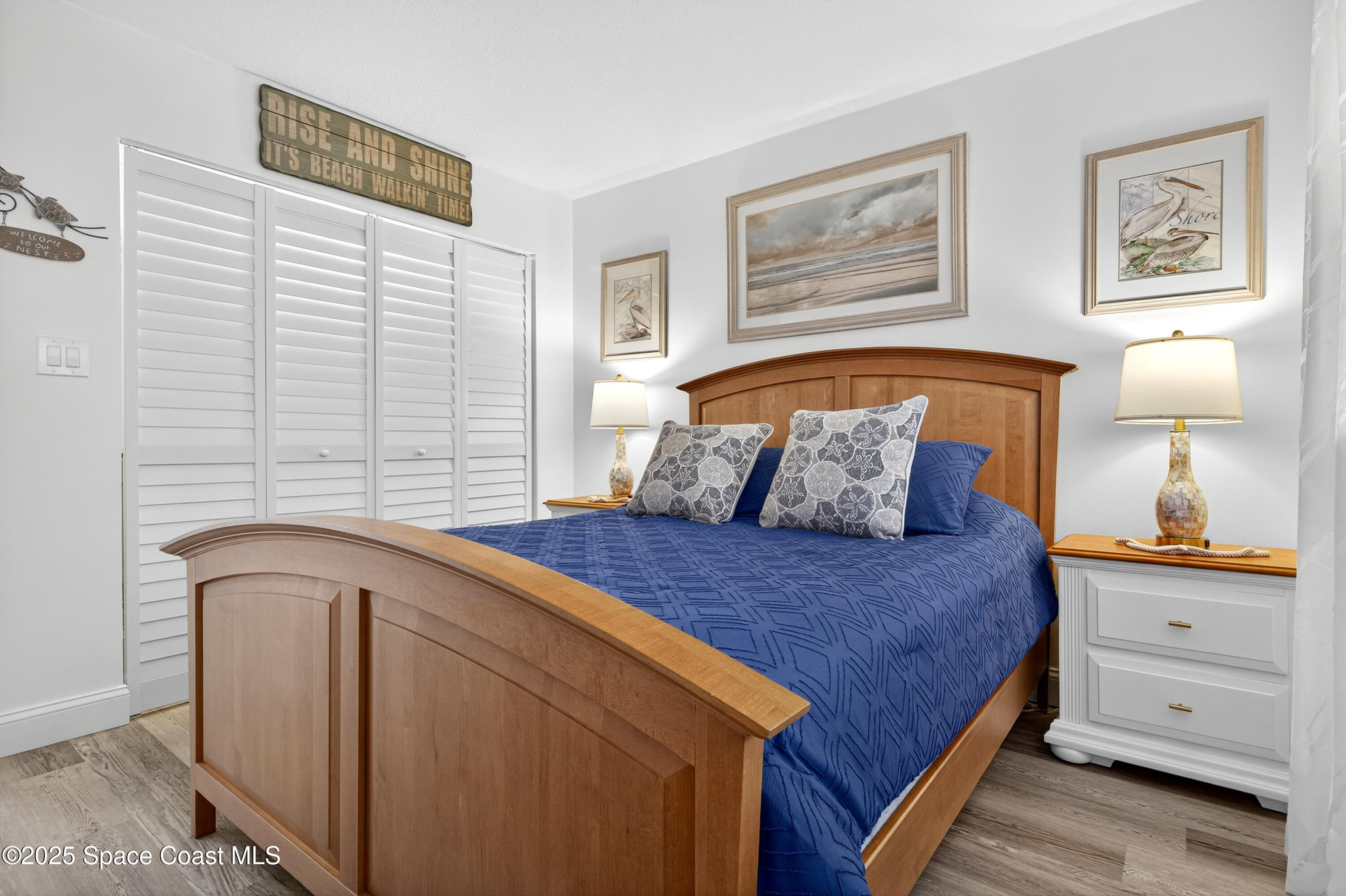 383 North Atlantic Avenue, Unit 105 Cocoa Beach, FL 32931 - Photo 39 of 67 a bedroom with a bed and a window