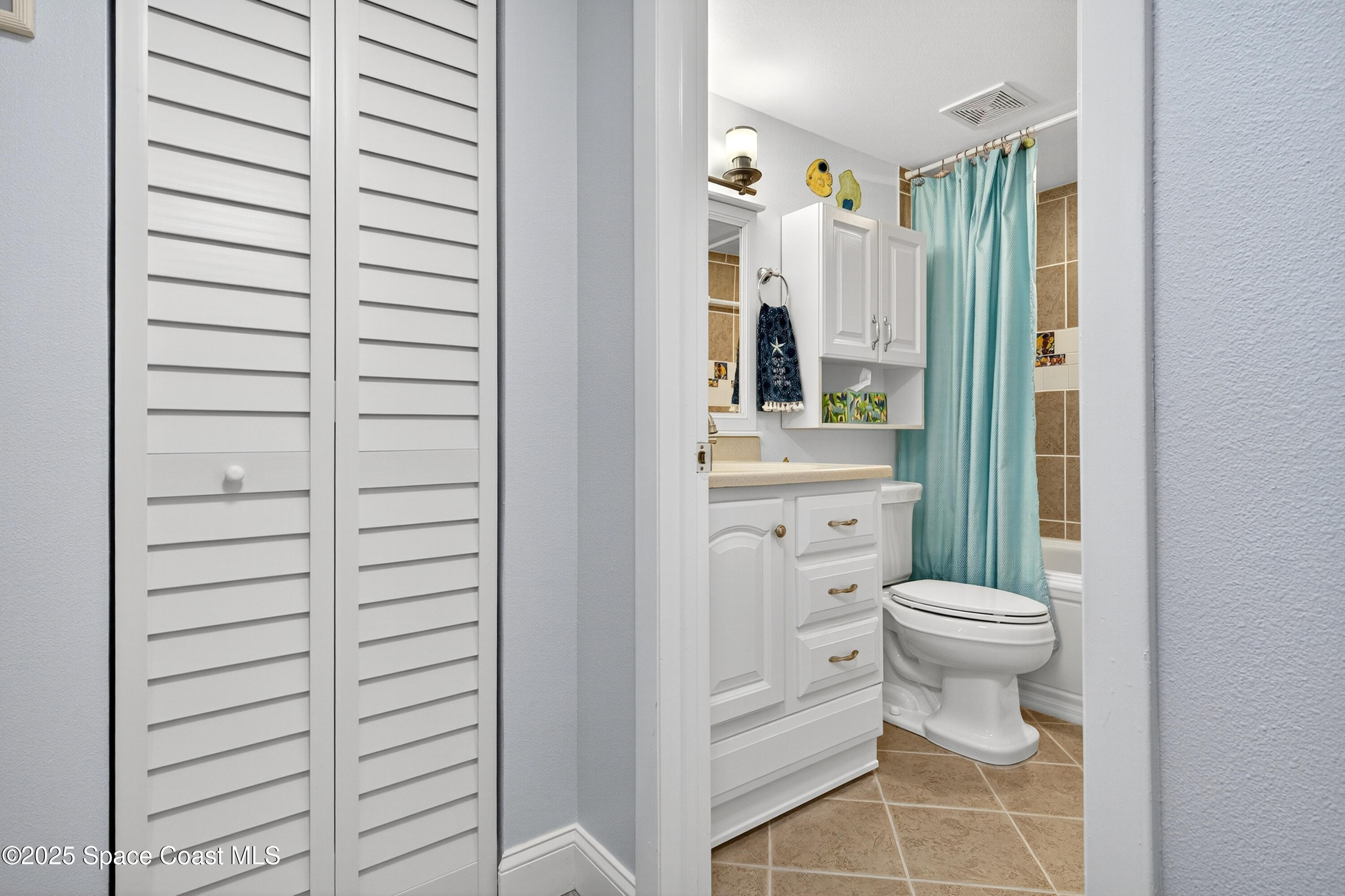 383 North Atlantic Avenue, Unit 105 Cocoa Beach, FL 32931 - Photo 41 of 67 a bathroom with a toilet and a shower