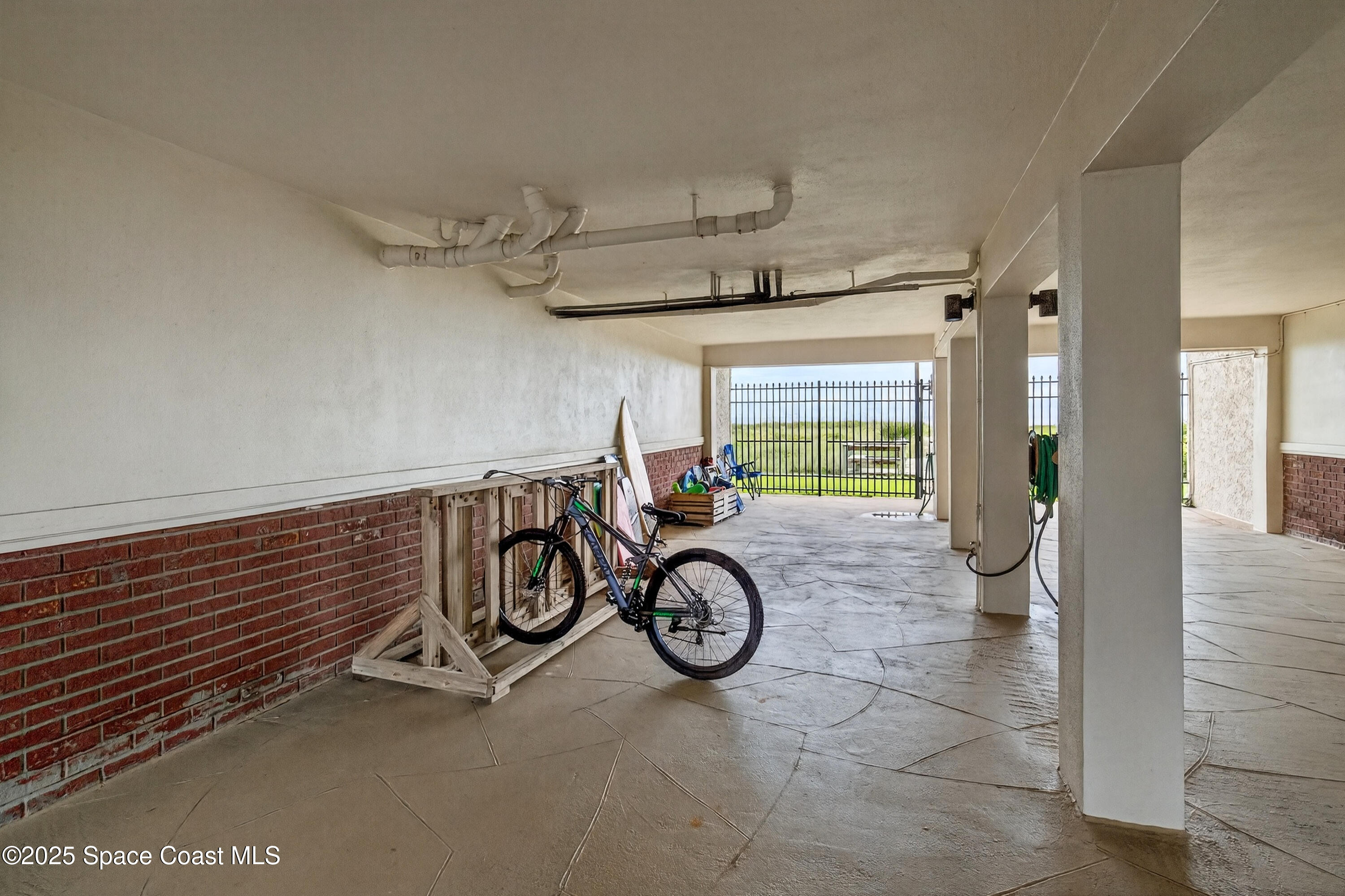 383 North Atlantic Avenue, Unit 105 Cocoa Beach, FL 32931 - Photo 48 of 67 a view of bike storage and utility room