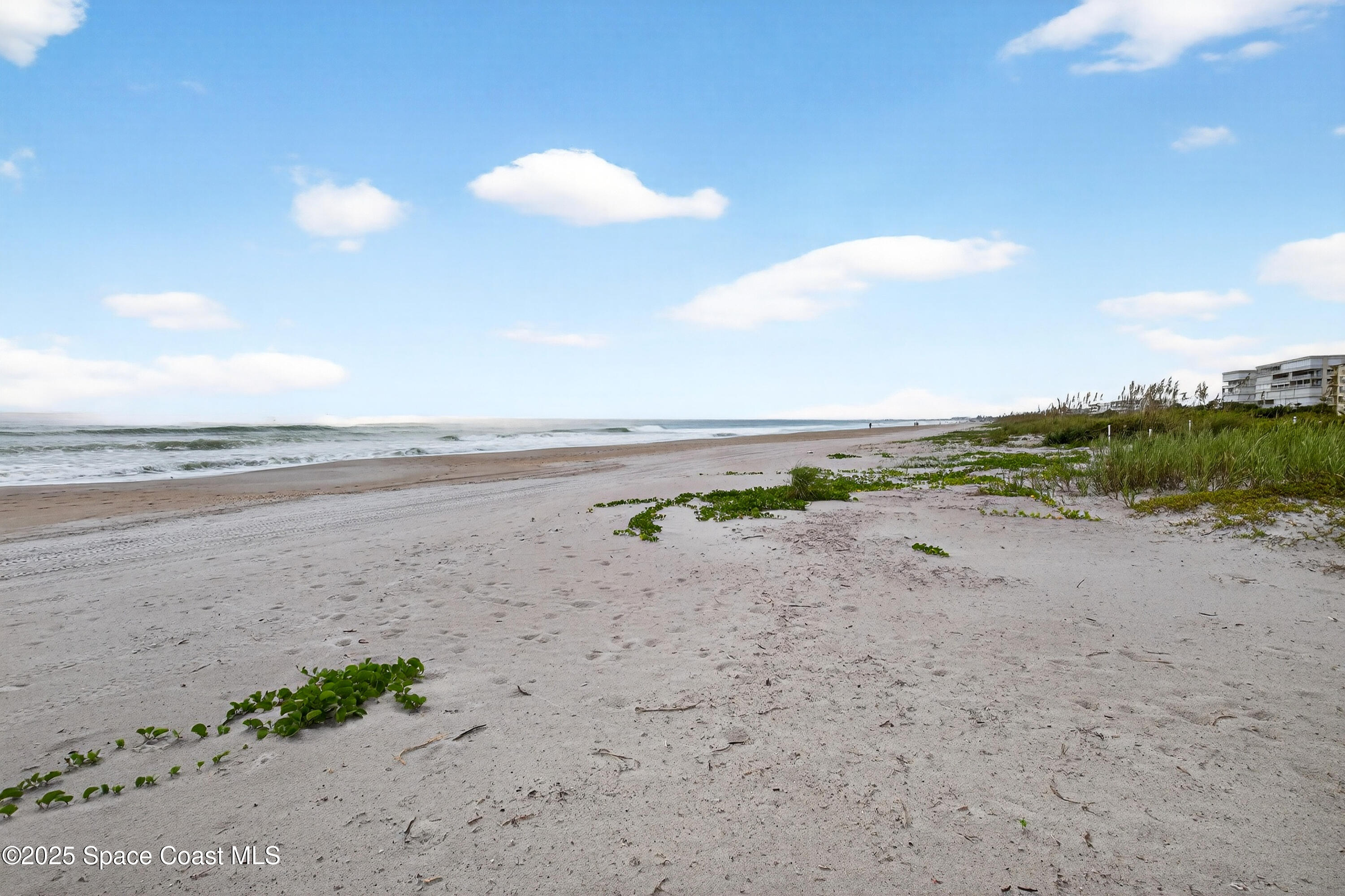 383 North Atlantic Avenue, Unit 105 Cocoa Beach, FL 32931 - Photo 52 of 67 a view of beach and ocean