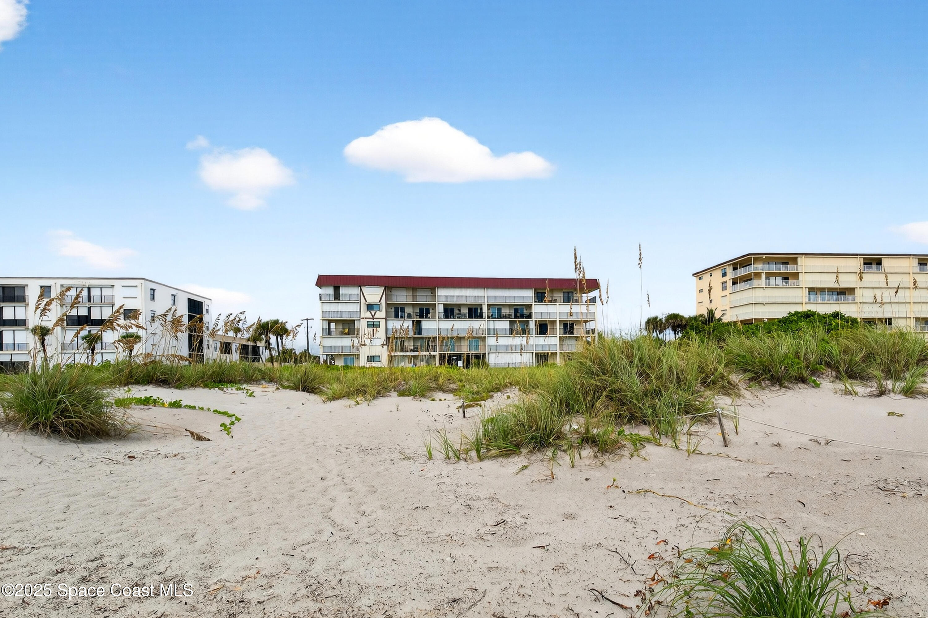 383 North Atlantic Avenue, Unit 105 Cocoa Beach, FL 32931 - Photo 53 of 67 a view of a lake with a house