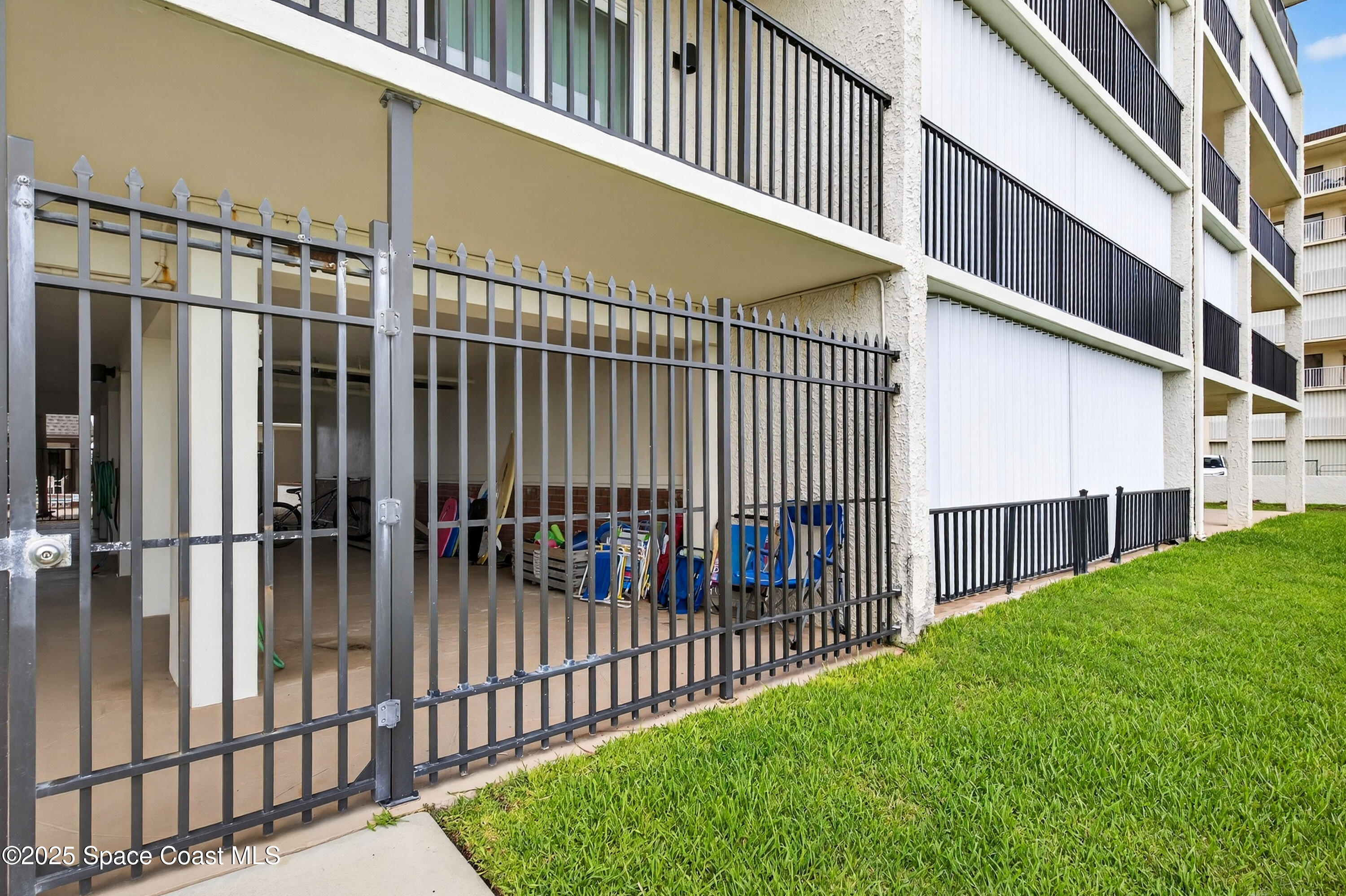 383 North Atlantic Avenue, Unit 105 Cocoa Beach, FL 32931 - Photo 55 of 67 a view of a garden from a balcony