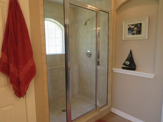 a bathroom with a bathtub and shower