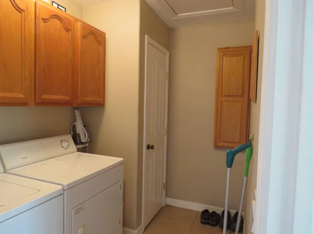 a dining room with furniture and front door