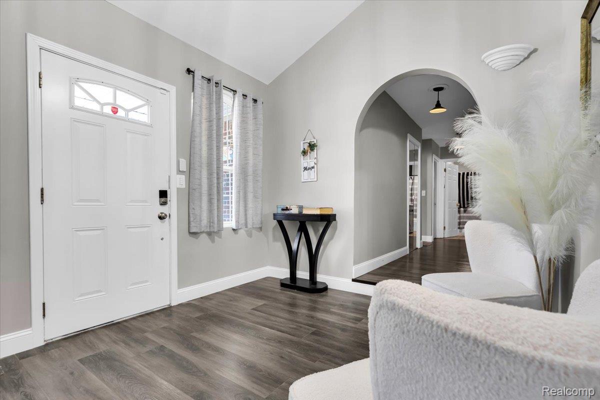 3260 Isabelle Street Inkster, MI 48141 - Photo 6 of 35 Entryway featuring wood-finish flooring, a white paneled door with decorative glass insert, and a smart lock