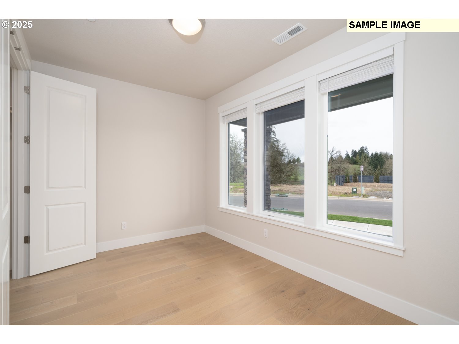 9017 North 5th Street, Unit 238 Ridgefield, WA 98642 - Photo 22 of 26 a big room with wooden floor and windows