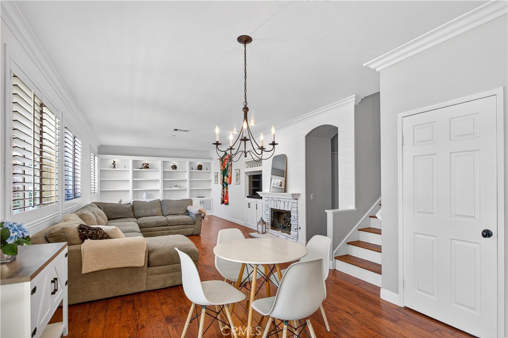 31928 Cercle Chambertin Temecula, CA 92591 - Photo 25 of 74 a living room with furniture a chandelier and a wooden floor
