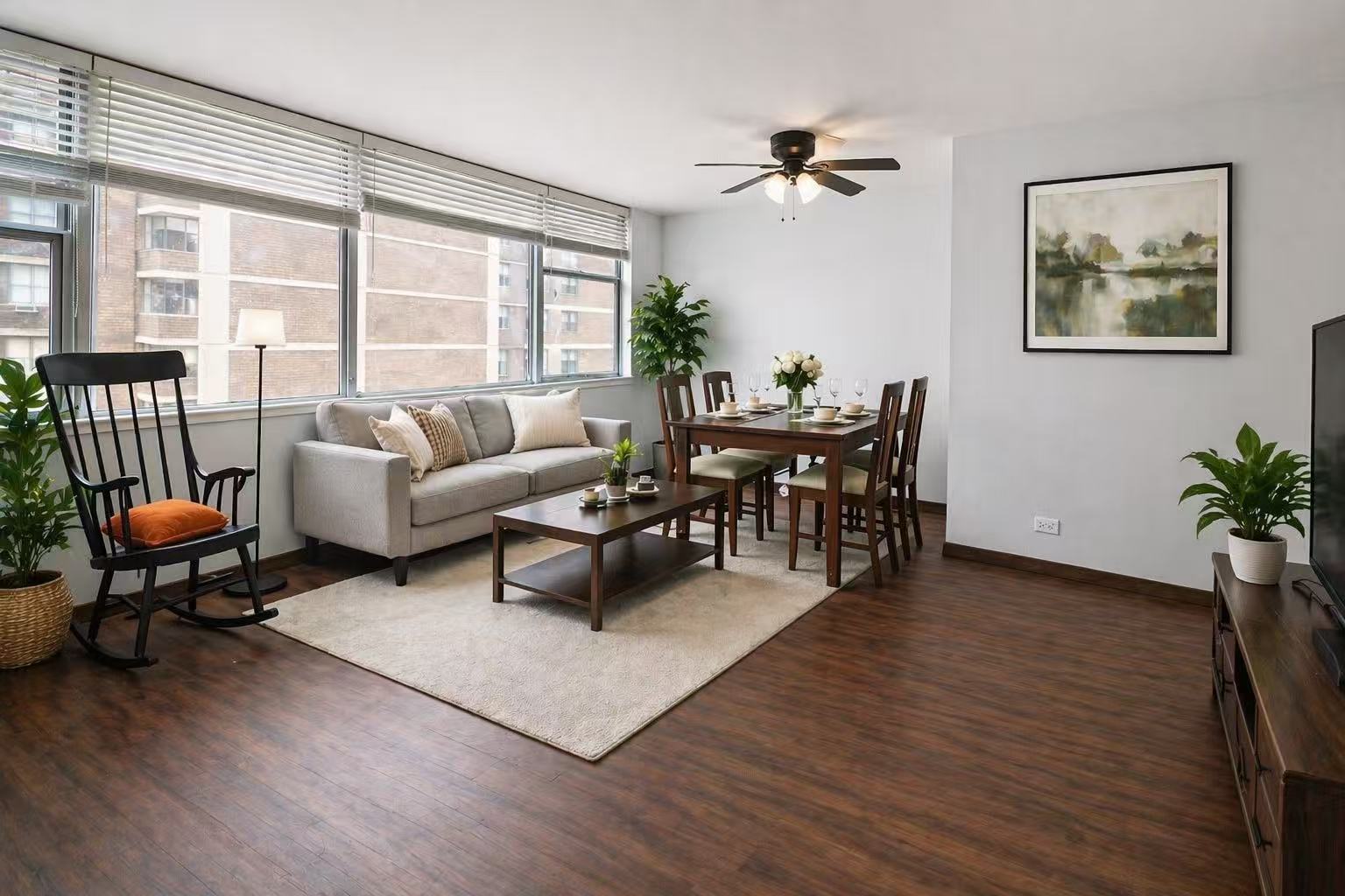 6301 North Sheridan Road, Unit 15B Chicago, IL 60660 - Photo 2 of 11 a living room with furniture and a large window