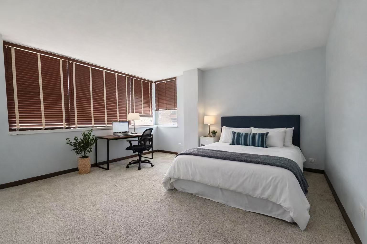 6301 North Sheridan Road, Unit 15B Chicago, IL 60660 - Photo 4 of 11 a bed room with a bed and a chair