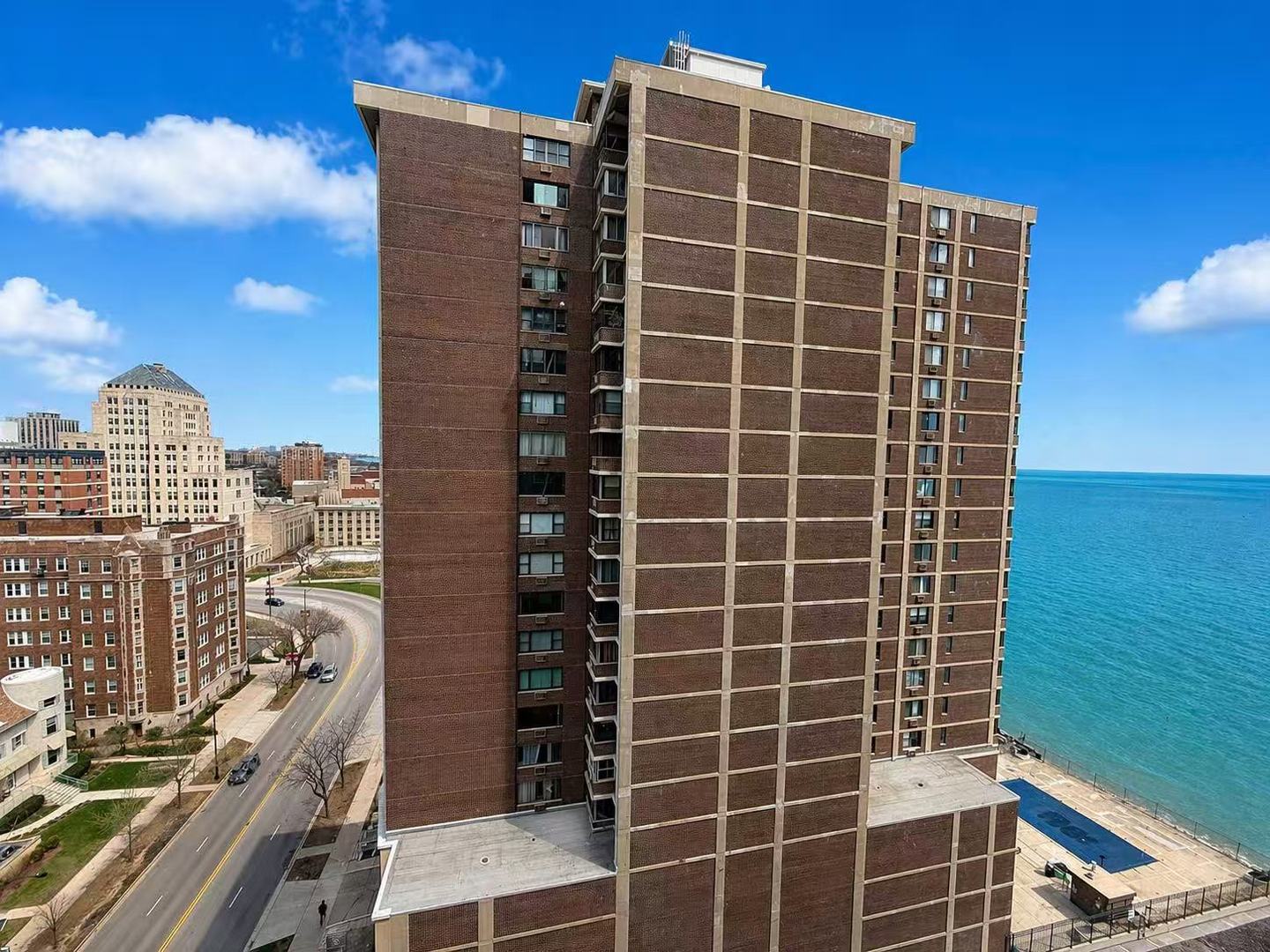 6301 North Sheridan Road, Unit 15B Chicago, IL 60660 - Photo 10 of 11 a front view of a building with glass windows