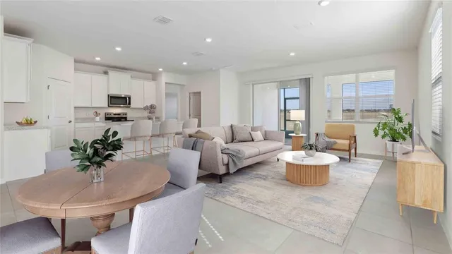 a living room with fireplace furniture and a potted plant