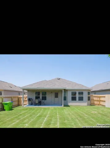 a view of an house with a backyard space