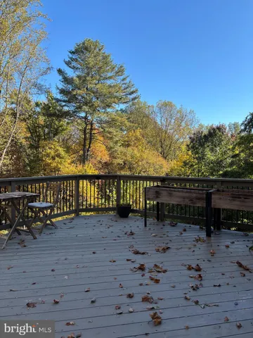 a view of a bench next to a yard