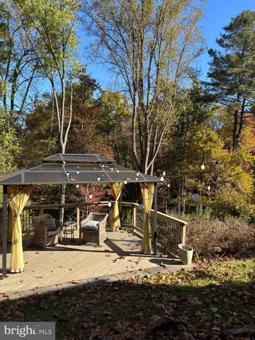 a view of a house with snow on the road