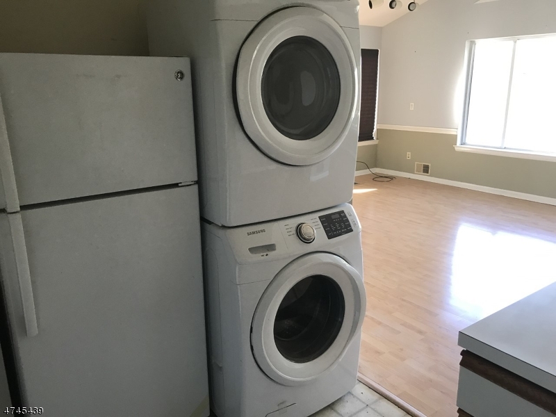 15 Falcon Ridge Way North, Unit 15 Hamburg, NJ 07419 - Photo 4 of 4 a close up view of a washer and dryer in a room