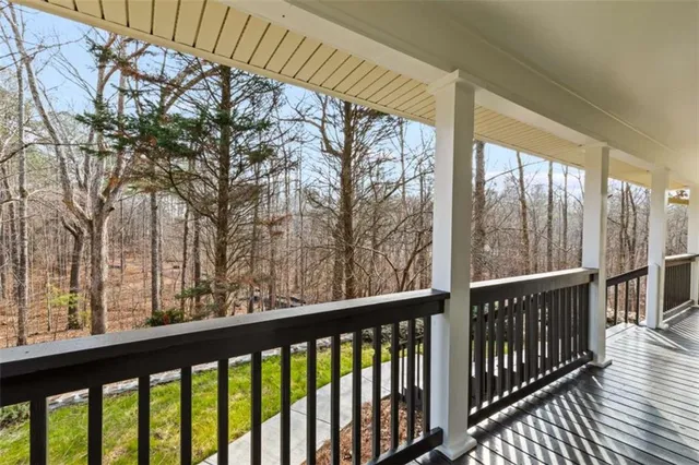 a view of trees from a balcony