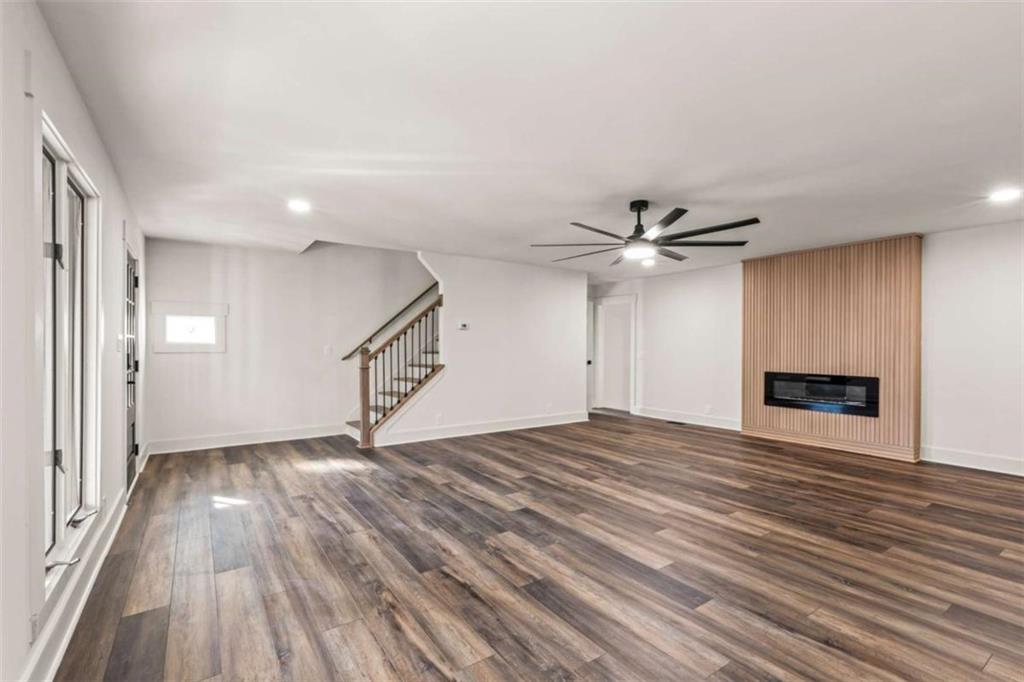 7448 Berea Road Winston, GA 30187 - Photo 14 of 43 a view of an empty room with wooden floor and a ceiling fan