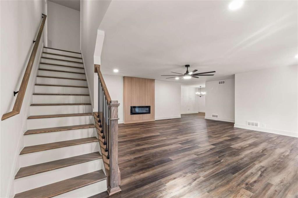 7448 Berea Road Winston, GA 30187 - Photo 15 of 43 an empty space with wooden floor and staircase