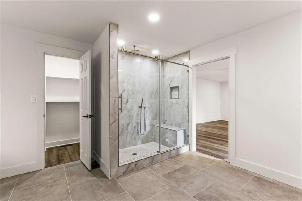 7448 Berea Road Winston, GA 30187 - Photo 33 of 43 a bathroom with a shower and a glass door