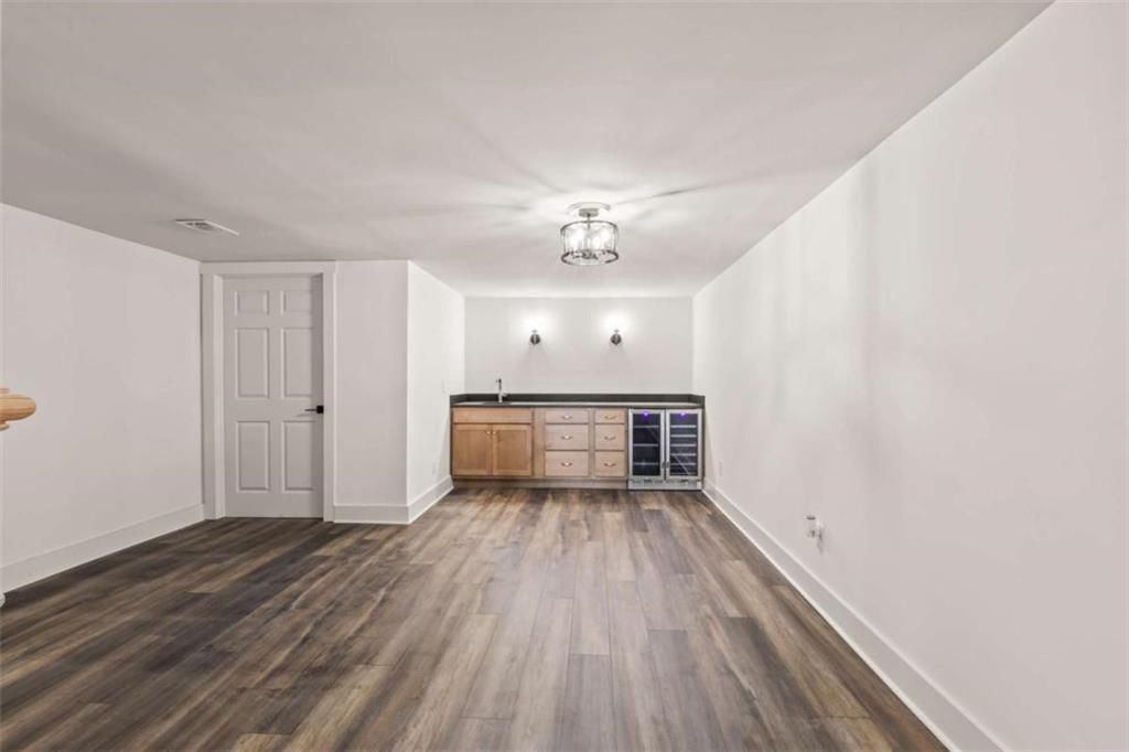 7448 Berea Road Winston, GA 30187 - Photo 40 of 43 a view of a room with wooden floors and ceiling fan